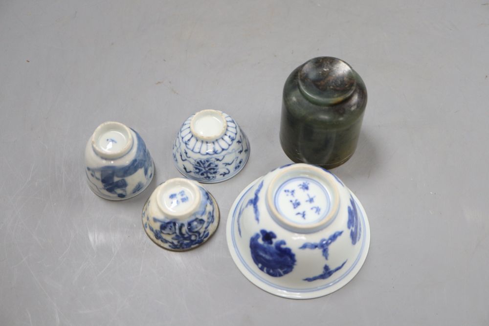 A group of Chinese cups, four ceramics, one jade and some have marks